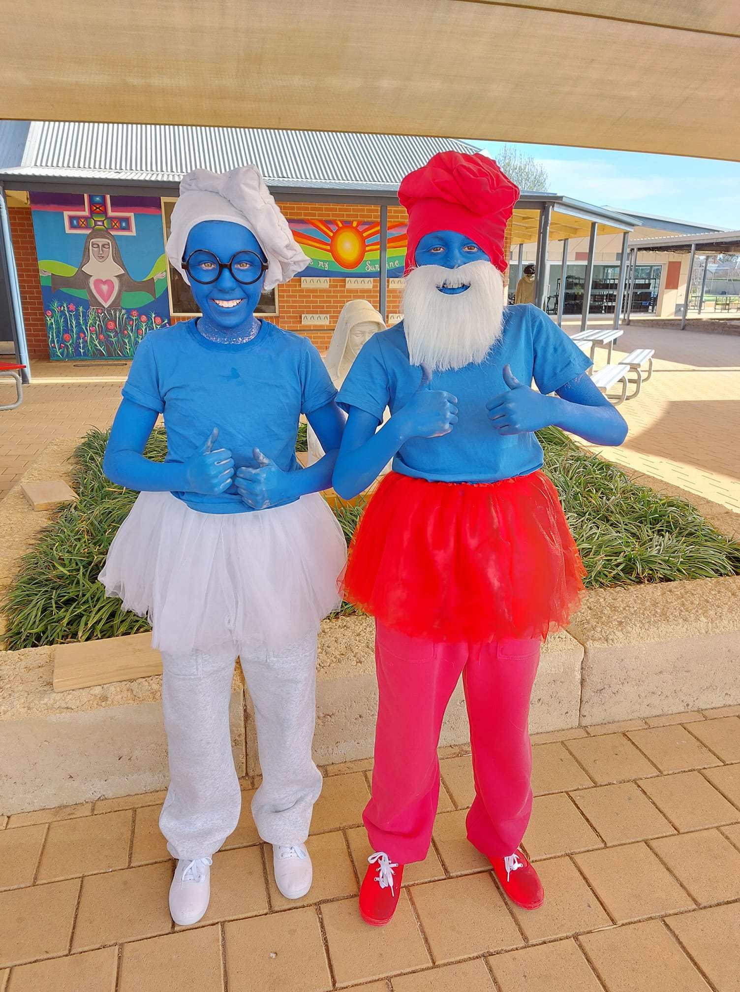 St Joseph's School Renmark students Isabelle Wutke and Amber Matulick, both 11, as Brainy Smurf and Papa Smurf.