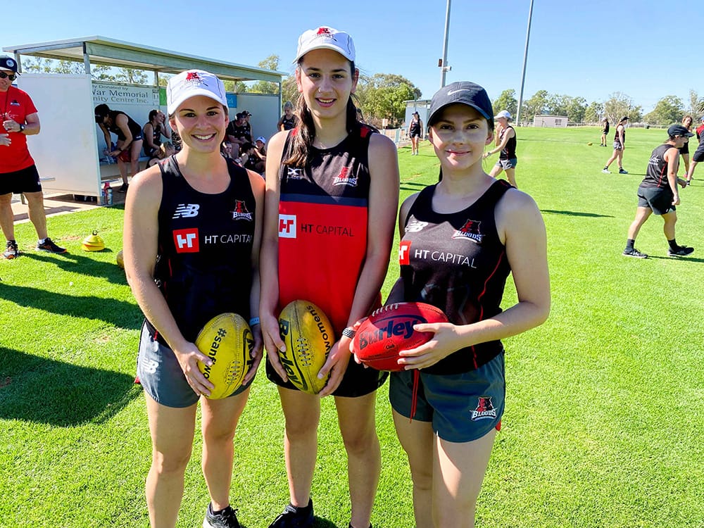 Local girls tackle footy
