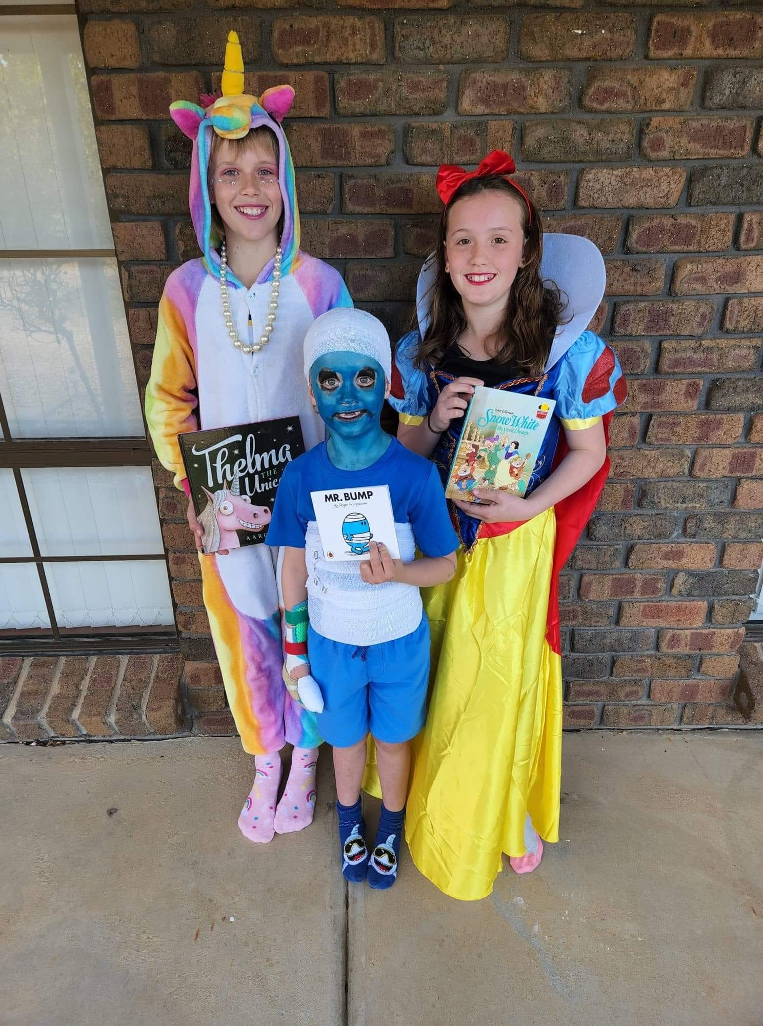 St Joseph's School Renmark students Jack, 11, Nate, 6, and Stella O’Bryan, 10, as Thelma the Unicorn, Mr Bump and Snow White.