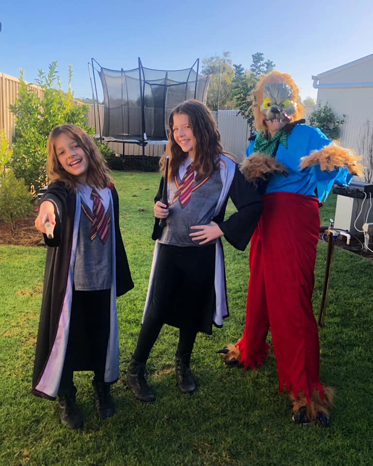 Loxton Primary School students Addison Williams, 7 and Lucy Williams, 10, both as Hermione from Harry Potter, and Alexis Williams, 11, as a wolf.