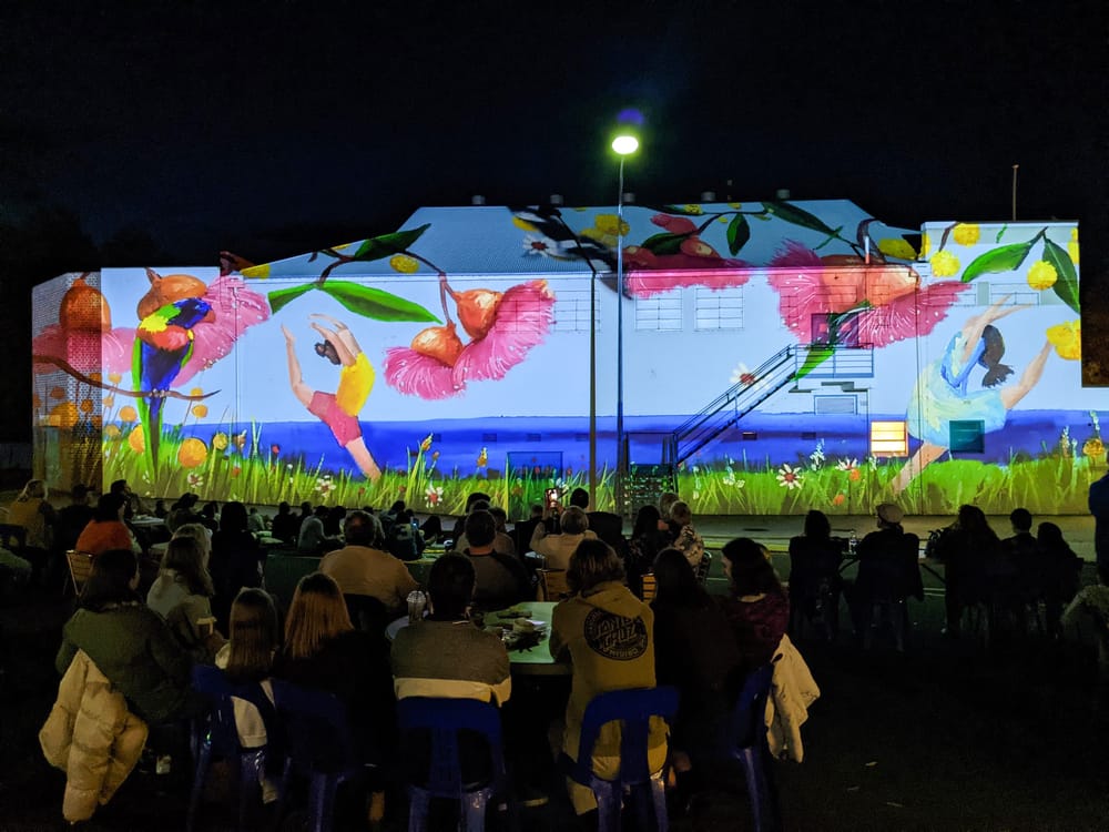 Hundreds dazzled by night mural post image